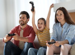 front-view-family-playing-videogame