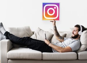 Man showing an Instagram icon