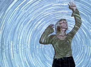 portrait-woman-posing-with-universe-projection-texture