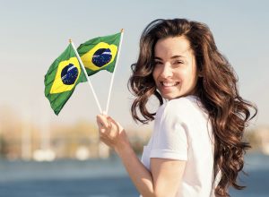 smiley-woman-holding-flag-medium-shot