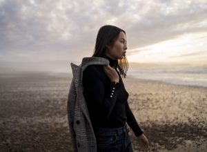 woman-enjoying-time-beach-side-view