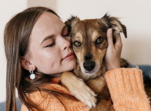 woman-petting-adorable-dog