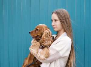 young-woman-holding-her-cute-dog